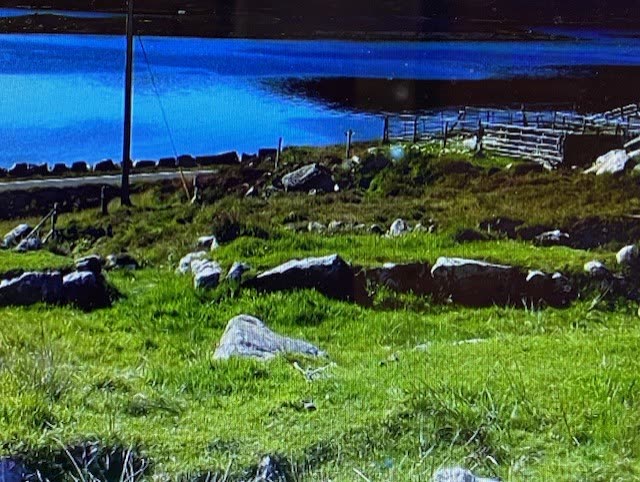 A ruined settlement on the shore, shown in one of the video guides