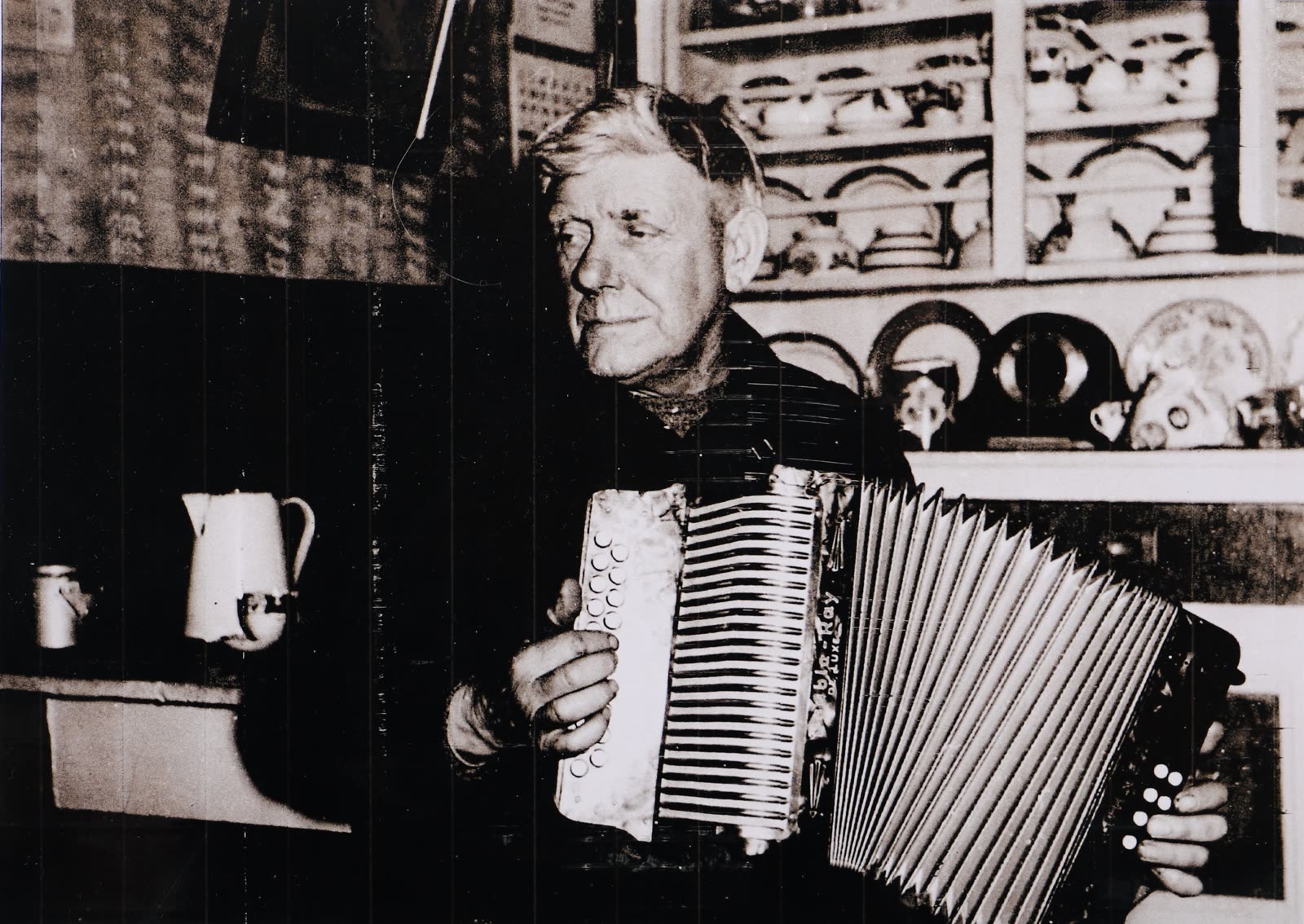 Archive photograph of a man playing the accordion