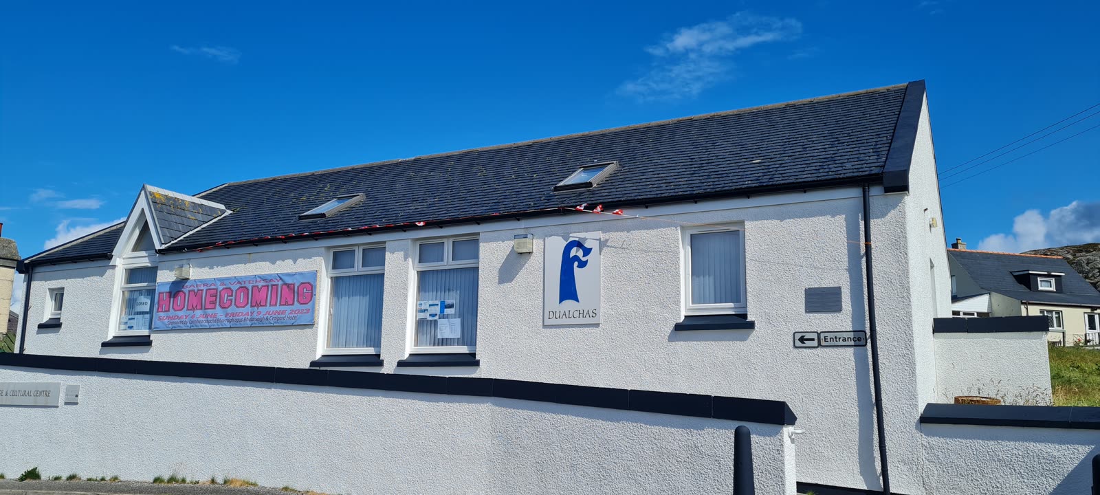 The Barra Heritage and Cultural Centre building in Castlebay, with the Dualchas sign on the wall